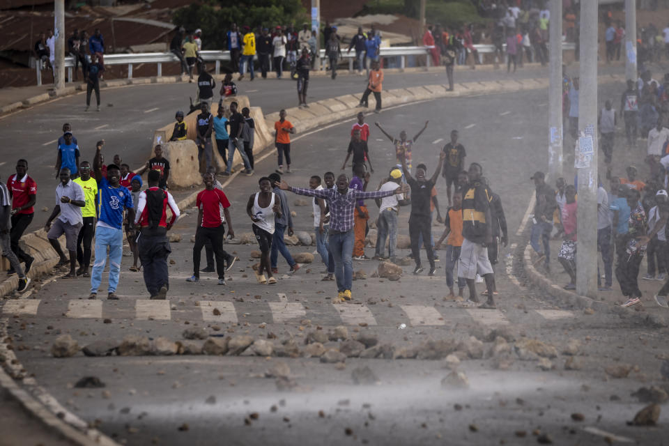 Protesters shout at police as they demonstrate in the Kibera slum of Nairobi, Kenya Monday, March 20, 2023. Hundreds of opposition supporters took to the streets of the Kenyan capital over the result of the last election and the rising cost of living, in protests organized by the opposition demanding that the president resigns from office. (AP Photo/Ben Curtis)