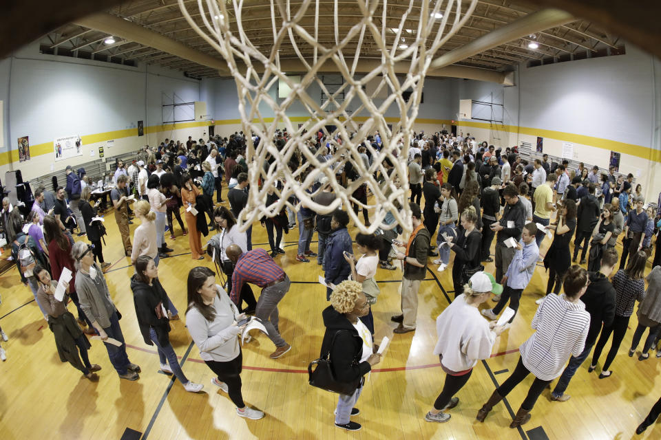 FILE - People wait to vote on Super Tuesday in the gymnasium at Cleveland Park Community Center, Tuesday, March 3, 2020, in Nashville, Tenn. While most GOP presidential candidates are focused only on early states like Iowa and New Hampshire, Donald Trump and Ron DeSantis also are looking ahead to Super Tuesday. March 5, 2024 is when the largest number of of delegates are up for grabs of any single day in the primary cycle. (AP Photo/Mark Humphrey, File)