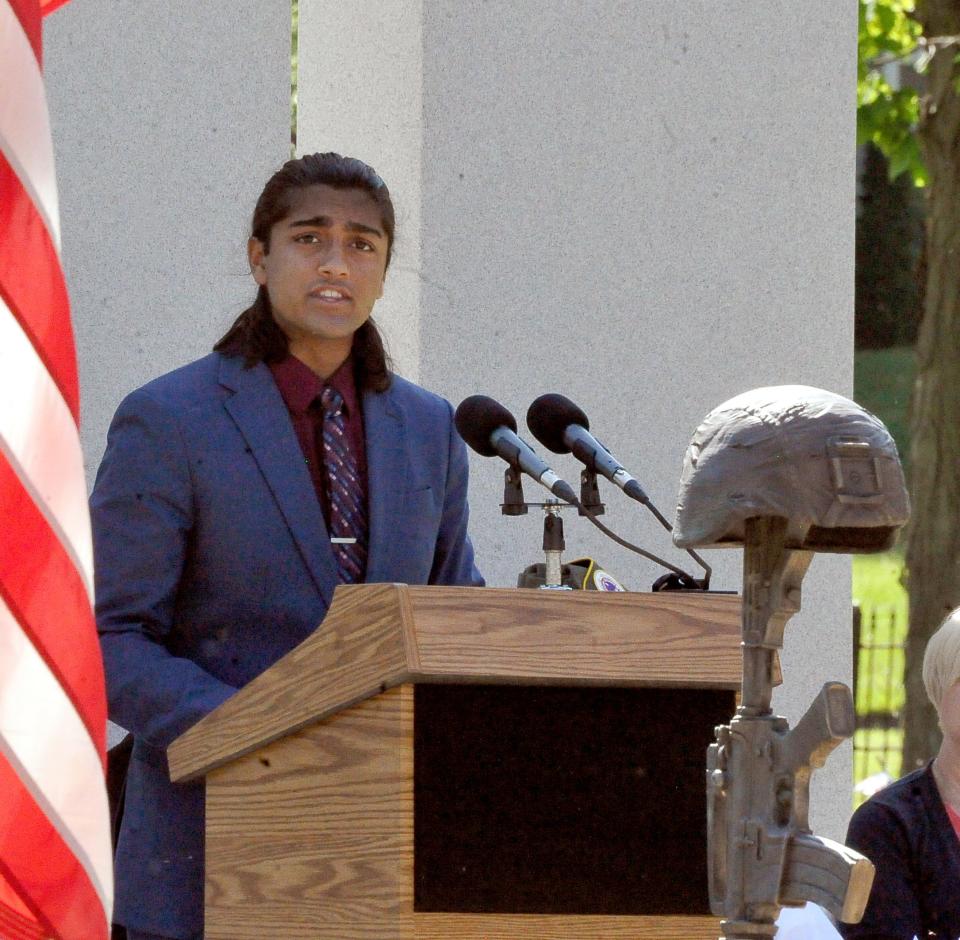 Ishaan Gireesh, a junior at Wooster High School, recites the poem "In Flanders Fields" during Wooster's  Memorial Day service.