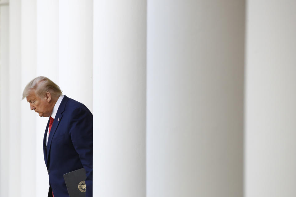 President Donald Trump arrives to speak at a coronavirus task force briefing in the Rose Garden of the White House, Sunday, March 29, 2020, in Washington. (AP Photo/Patrick Semansky)