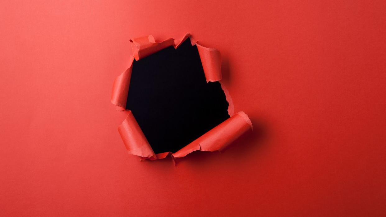 red paper with hole