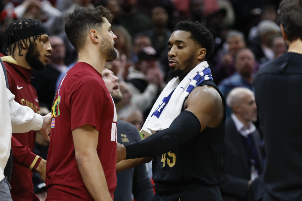 Cleveland Cavaliers guard Donovan Mitchell walks to the locker room after fighting with Memphis Grizzlies forward Dillon Brooks during the second half of an NBA basketball game, Thursday, Feb. 2, 2023, in Cleveland. Mitchell and Brooks were ejected from the game. (AP Photo/Ron Schwane)