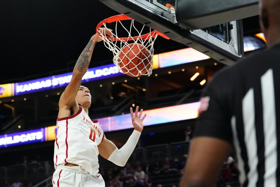 November 6, 2023;  Las Vegas, Nevada, USA;  The USC Trojans protect Kobe Johnson's (0) dunks against the Kansas State Wildcats during the first half at T-Mobile Arena.  Mandatory Credit: Stephen R. Sylvanie-USA TODAY Sports