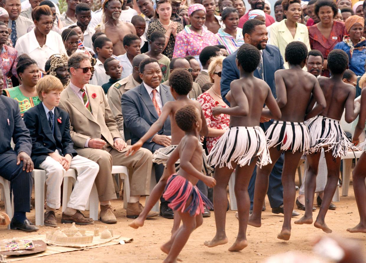 Prince Harry with Prince Charles during his visit to Africa in 1997 shortly after his mother died. (Getty Images)