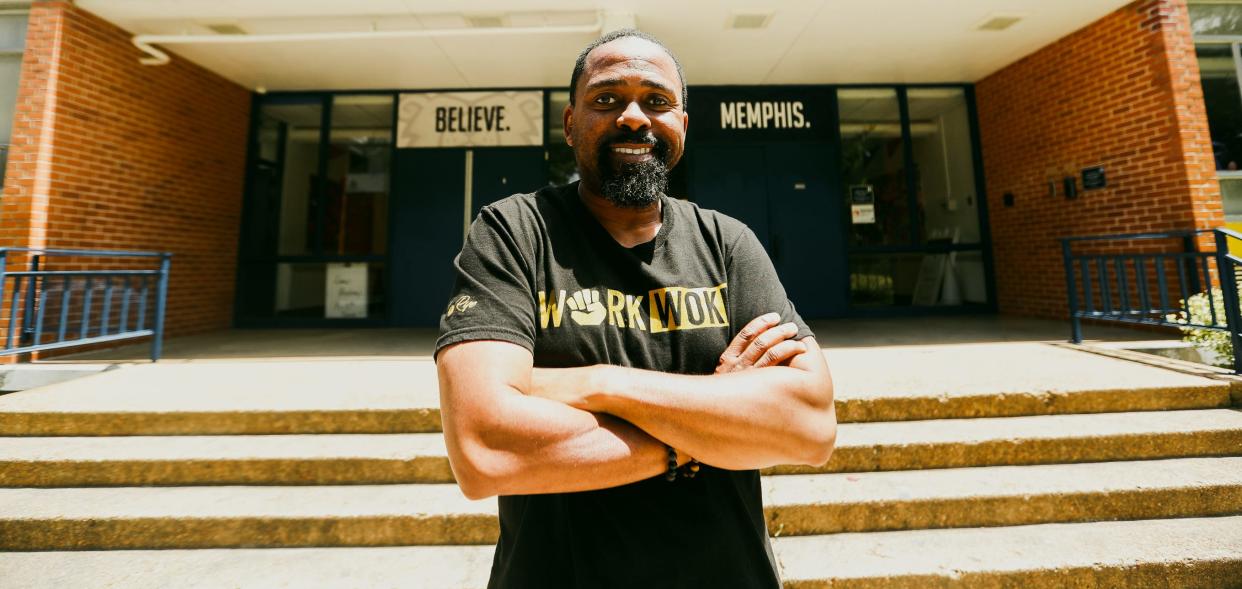 Frank Johnson stands outside Believe Academy in Memphis. Johnson suffered a stroke in September, but is recovering and has continued to get better.