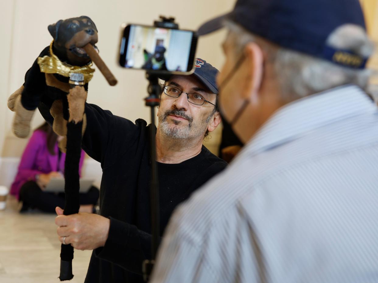 Actor and comedian Robert Smigel performs as Triumph the Insult Comic Dog in the hallways outside the House Select Committee to Investigate the January 6th Attack on the U.S. Capitol hearing in the Cannon House Office Building on June 16, 2022 in Washington, DC