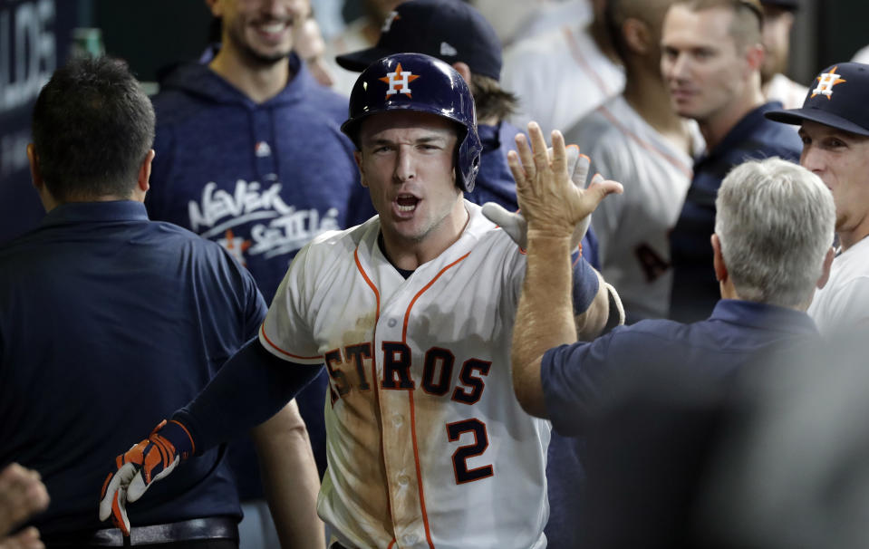 Houston Astros' Alex Bregman (2) celebrates after hitting a solo home run against Cleveland Indians' pitcher Trevor Bauer during the seventh inning of Game 2 of a baseball American League Division Series, Saturday, Oct. 6, 2018, in Houston. (AP Photo/David J. Phillip)