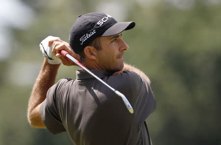 FILE PHOTO: Australia's Geoff Ogilvy tees off on the ninth hole during the second round of the 2013 U.S. Open golf championship at the Merion Golf Club in Ardmore, Pennsylvania, June 14, 2013. REUTERS/Matt Sullivan/File Photo