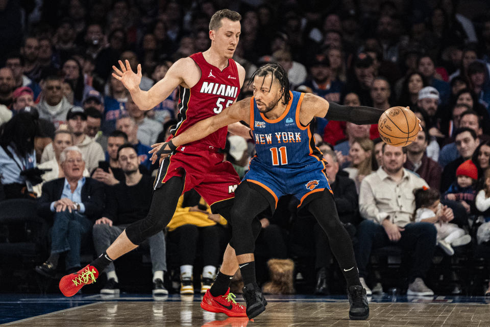 New York Knicks guard Jalen Brunson (11) posts up as Miami Heat forward Duncan Robinson (55) defends during the first half of an NBA basketball game, Saturday, Jan. 27, 2024, in New York. (AP Photo/Peter K. Afriyie)