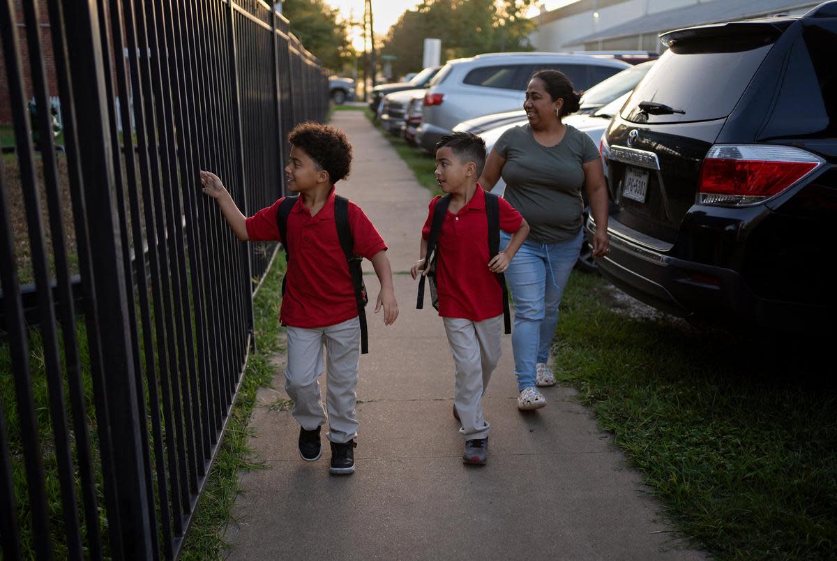 Celina Manzano takes her children to school at Pugh Elementary School in East Houston on October 2, 2023.