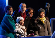 <p>President Barack Obama and his family react as his daughter Sasha (2nd L) pushes the button to light the National Christmas Tree, during a ceremony on the Ellipse in Washington December 9, 2010. Also pictured is first lady Michelle Obama (2nd R), her mother Marian Robinson (L) and daughter Malia. (Kevin Lamarque/Reuters) </p>