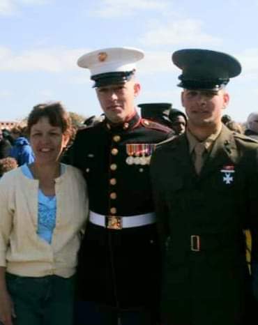 Ryan Hendrix, center, poses with his mother, Heidi, and his brother, Donald, who had just graduated from boot camp at Parris Island, South Carolina.