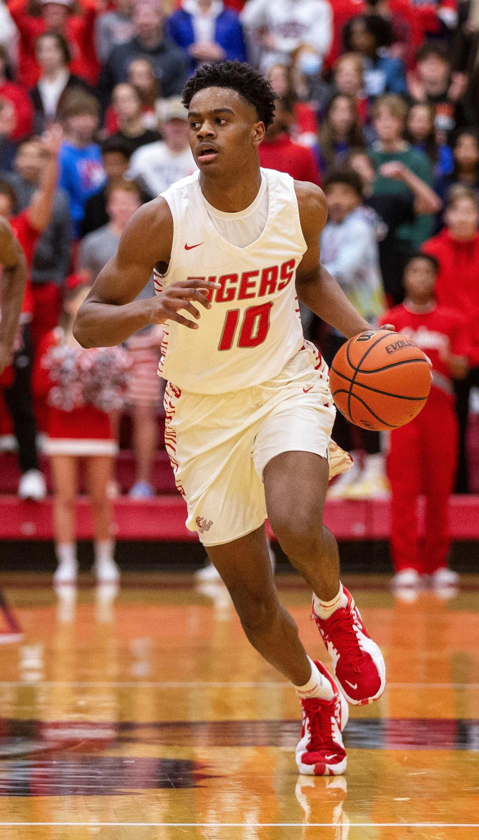 Fishers' Jalen Haralson drives down the court versus Pike on January 7, 2022.
