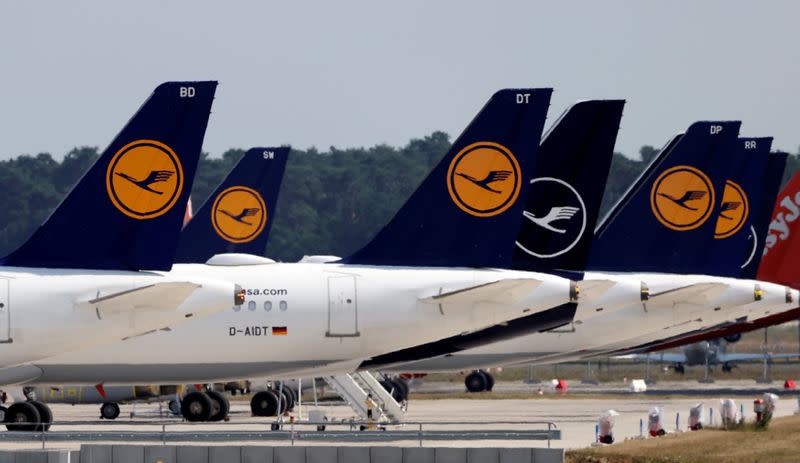 FILE PHOTO: Airplanes of German carrier Lufthansa are parked at the Berlin Schoenefeld airport in Schoenefeld