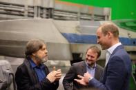 <p>Mark Hamill talks to Prince William while <i>Episode VIII </i>director Rian Johnson looks on. <i>(Photo: <a href="https://twitter.com/KensingtonRoyal?ref_src=twsrc%5Egoogle%7Ctwcamp%5Eserp%7Ctwgr%5Eauthor" rel="nofollow noopener" target="_blank" data-ylk="slk:Twitter/Kensington Palace;elm:context_link;itc:0;sec:content-canvas" class="link ">Twitter/Kensington Palace</a>)</i></p>