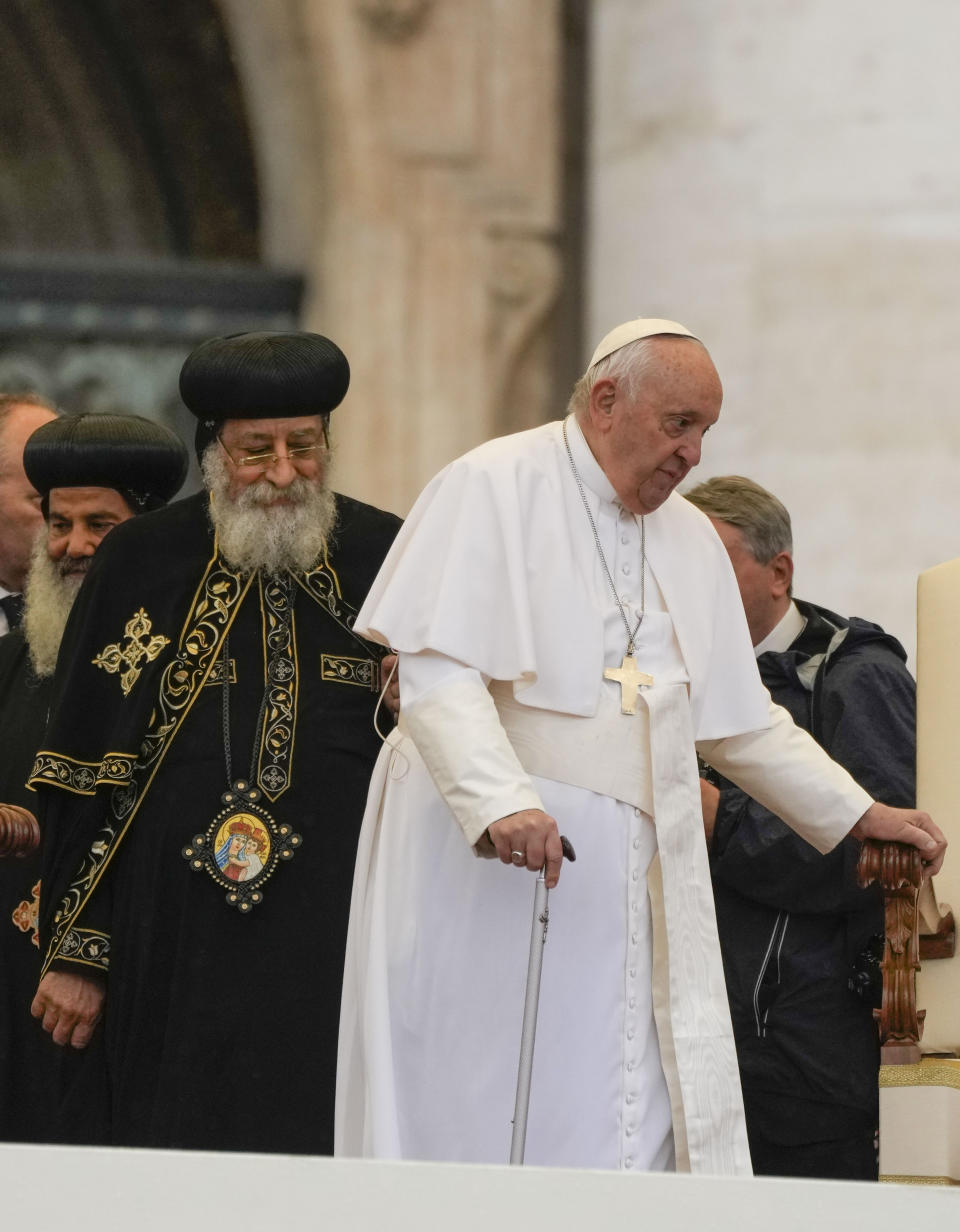 Pope Francis, right, arrives for his weekly general audience in St. Peter's Square at The Vatican, with the leader of the Coptic Orthodox Church of Alexandria, Tawadros II,Wednesday, May 10, 2023. (AP Photo/Alessandra Tarantino)