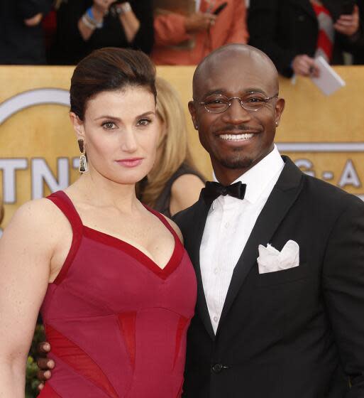 Idina Menzel and Taye Diggs arrive at the 19th Annual Screen Actors Guild Awards at the Shrine Auditorium in Los Angeles on Sunday Jan. 27, 2013. (Photo by Todd Williamson/Invision for The Hollywood Reporter/AP Images)