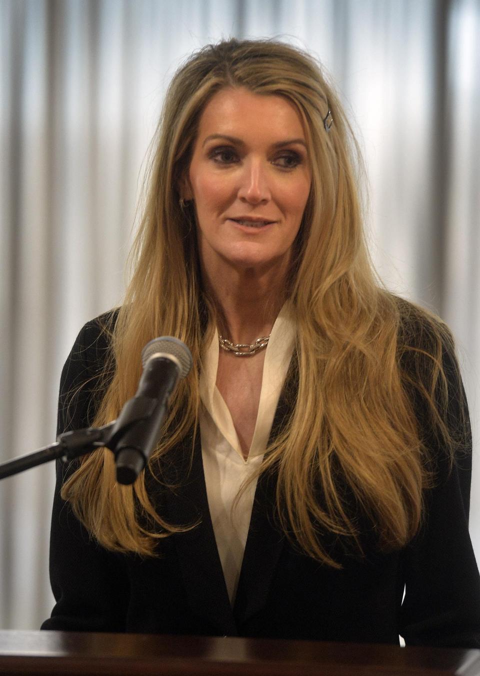 U.S. Sen.-designate Kelly Loeffler, a Republican businesswoman who will soon become Georgia's newest U.S. senator, answers questions at a press conference at the Georgia Ports Authority administrative offices Thursday, Jan. 2, 2020, at the Garden City Terminal in Garden City, Ga. Loeffler, who is scheduled to be sworn in when the Senate convenes Monday, Jan. 7, in Washington, said Thursday she plans to vote against removing President Donald Trump from office. (Steve Bisson/Savannah Morning News via AP)