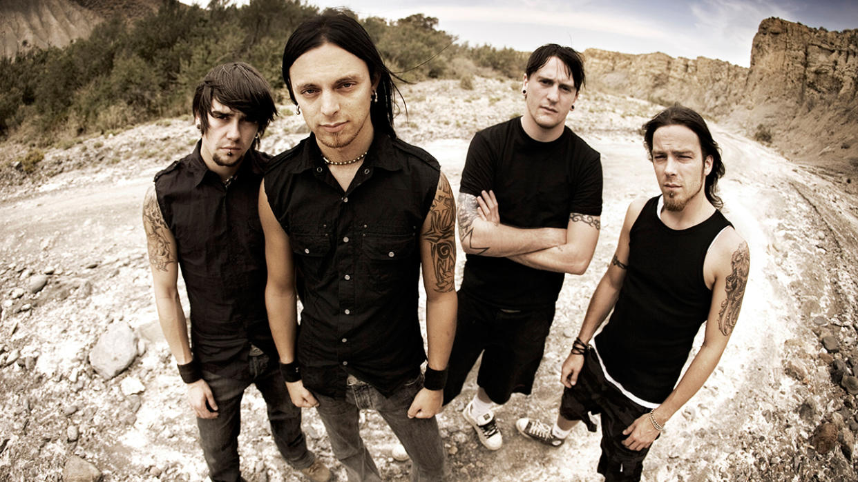  A press shot of Bullet For My Valentine in the Poison era, stood outside on rubble 