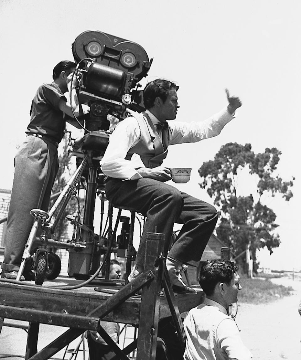 Orson Welles directs a scene from "Citizen Kane" on location in Hollywood in July 1940, with cinematographer Gregg Toland handling the camera.