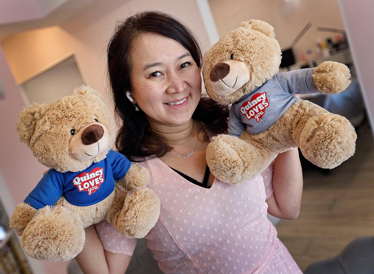 Thuy Leung of Quincy came to the United States as a child refugee from Vietnam. She has created a 'Quincy Loves You' bear for refugee children passing through the temporary shelter at Eastern Nazarene College.