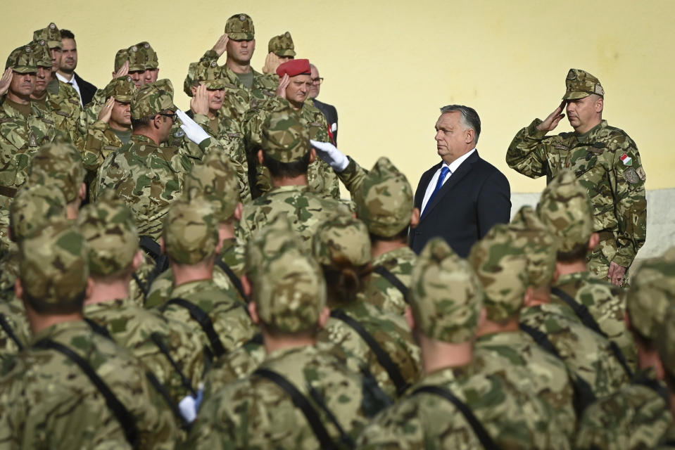 FILE - Hungarian Prime Minister Viktor Orban, attend the oath-taking ceremony of 250 volunteer soldiers in Budapest, Hungary, Saturday, Oct. 15, 2022. The leaders of four Central European countries are holding a summit in Slovakia to discuss energy, migration and regional cooperation. But the meeting on Thursday, Nov. 24, 2022 in Kosice, Slovakia, could redefine the nature of cooperation of the Visegrad 4 regional alliance that has been strained by a divergence of approaches to the war in Ukraine. (Szilard Koszticsak, MTI via AP, File)