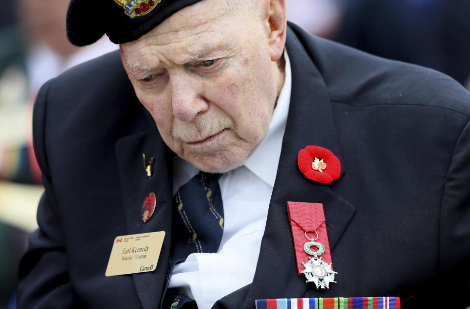 Canadian World War II and D-Day veteran Earl Kennedy attends a commemoration ceremony at the Beny-sur-Mer Canadian War Cemetery in Reviers, Normandy, France, Wednesday, June 5, 2019. A ceremony was held on Wednesday for Canadians who fought and died on the beaches and in the bitter bridgehead battles of Normandy during World War II. (AP Photo/David Vincent)