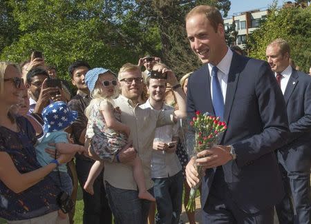 Britain's Prince William meets with wellwishers as he officially opens the Dickson Poon University of Oxford China Centre, in Oxford, central England September 8, 2014. REUTERS/Arthur Edwards/pool