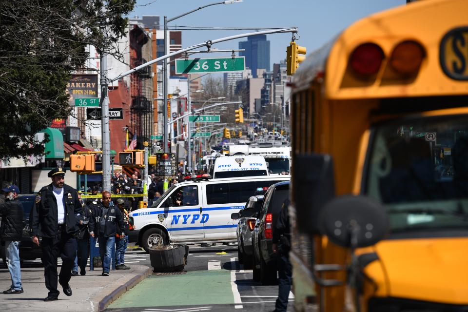 Emergency personel crowd the streets near a subway station in New York City