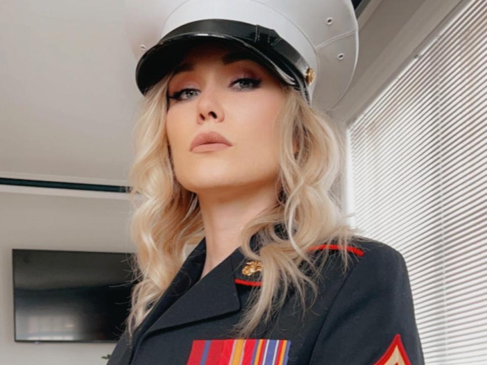 Taylor Gunner wearing her marines dress uniform during a shoot for OnlyFans