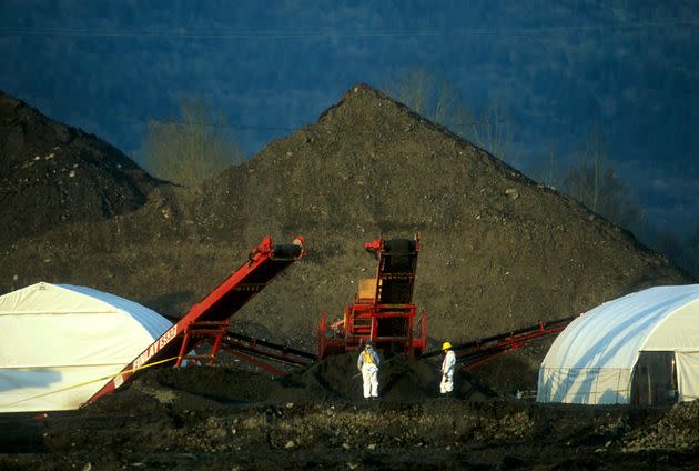 Forensic workers collect evidence at accused serial killer Robert Pickton's pig farm, Canada's largest crime scene.