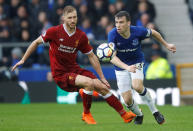 <p>Everton’s Seamus Coleman keeps an eye on Liverpool’s Ragnar Klavan </p>