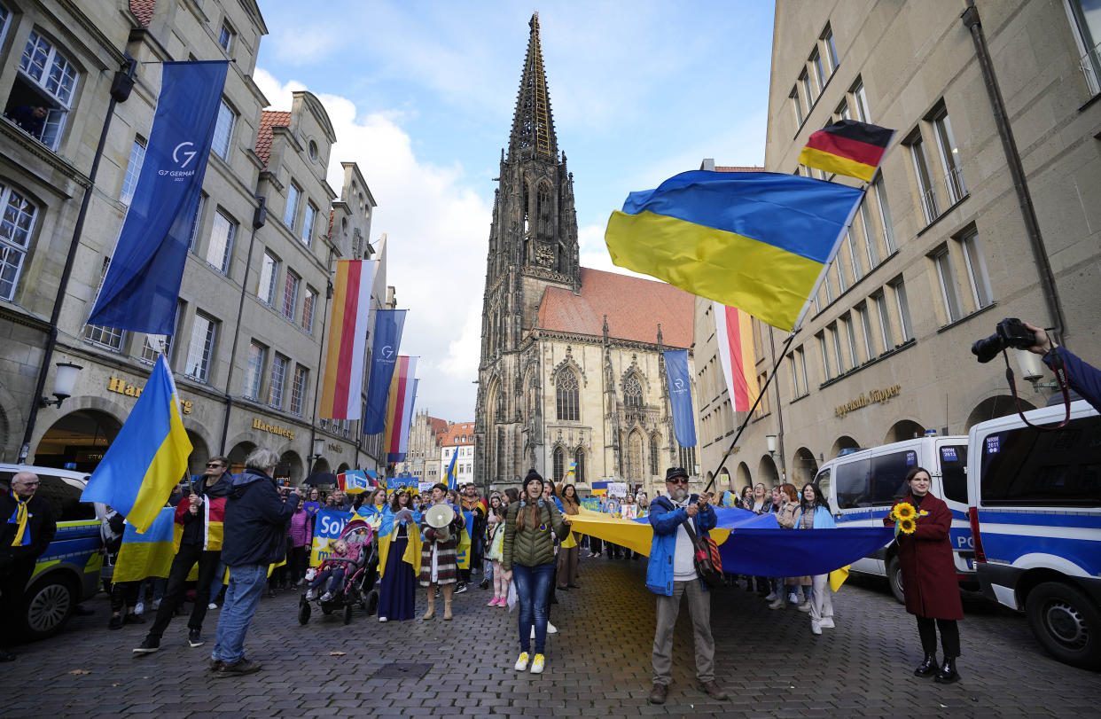 People protest against Russia's war in Ukraine outside the G7 Foreign Ministers' Meeting in Muenster, Germany, Friday, Nov. 4, 2022. (AP Photo/Martin Meissner)