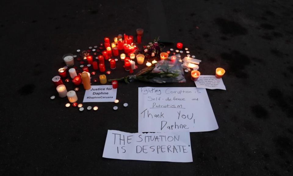 Candles are lit in memory of Malta’s Daphne Caruana Galizia in Brussels, Belgium on Wednesday.