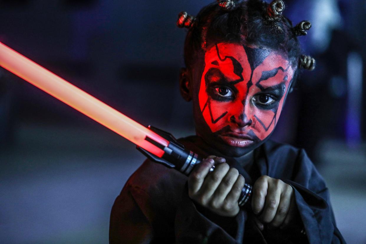 Christian Knox, 6, of Ypsilanti, attended Space Dive, a party set on the planet of Tatooine in the "Star Wars" galaxy six months after the Death Star is destroyed, dressed as Darth Maul at Tangent Gallery in Detroit on Saturday, May 4, 2024.