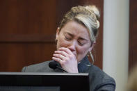 Actor Amber Heard testifies in the courtroom at the Fairfax County Circuit Courthouse in Fairfax, Va., Monday, May 16, 2022. Actor Johnny Depp sued his ex-wife Amber Heard for libel in Fairfax County Circuit Court after she wrote an op-ed piece in The Washington Post in 2018 referring to herself as a "public figure representing domestic abuse." (AP Photo/Steve Helber, Pool)