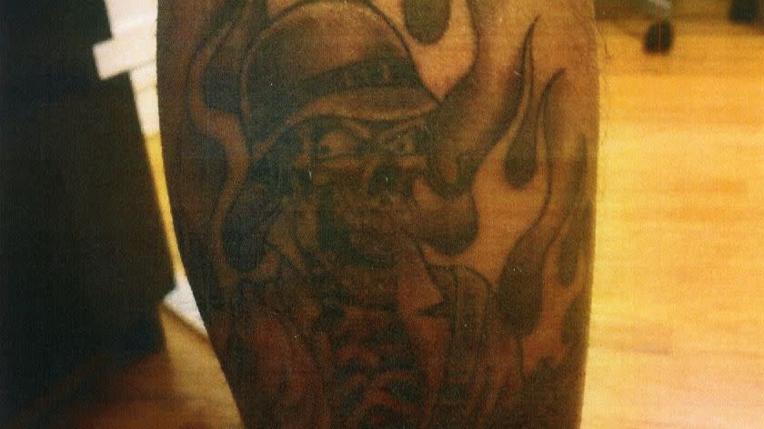 Los Angeles County Sheriff's Deputy Samuel Aldama admitted as part of a lawsuit this year that he has a skull tattoo on his calf associated with the Compton Station, where he worked. The photo of his tattoo emerged in the lawsuit. The department has a long history with deputy tattoos that officials say represent cliques that promote overly aggressive policing. NOTE: The photo is an exhibit to a motion filed in court by plaintiff Andrew Taylor.
