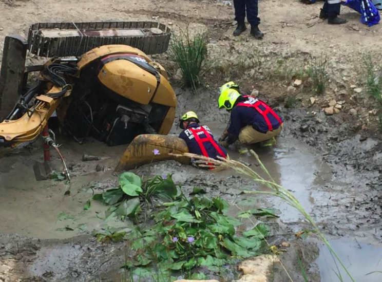 Firefighters had to drain mud and water before being able to rescue Mr Miller (Facebook/Saimaa Miller)