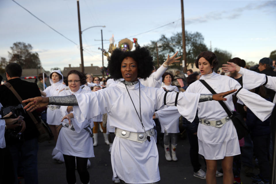 Members of the Krewe of Chewbacchus, a Mardi Gras Krewe, hold a parade with members dressed as Princess Leia, in honor of actress Carrie Fisher, who played Leia in the Star Wars movie series, in New Orleans, Friday, Dec. 30, 2016. Fisher died on December 27, 2016, at the age of 60. (AP Photo/Gerald Herbert)