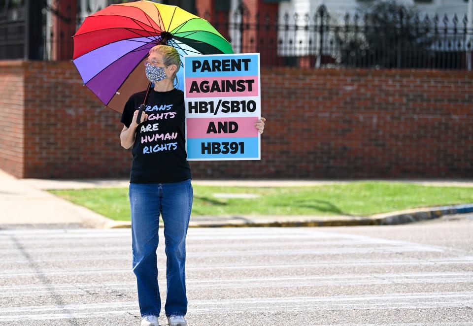 Jan Newton crosses the street to attend a March 30 rally at the Alabama State House in Montgomery to draw attention to anti-transgender legislation. (Photo: Julie Bennett via Getty Images)