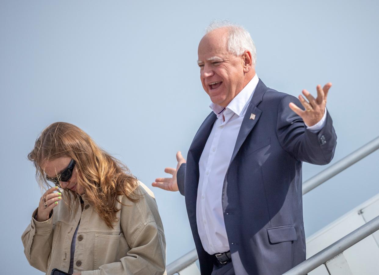 Democratic vice presidential candidate Tim Walz arrives at Central Wisconsin Airport alongside daughter Hope Walz in Mosinee, Wis. with his daughter on Friday, September 13, 2024.