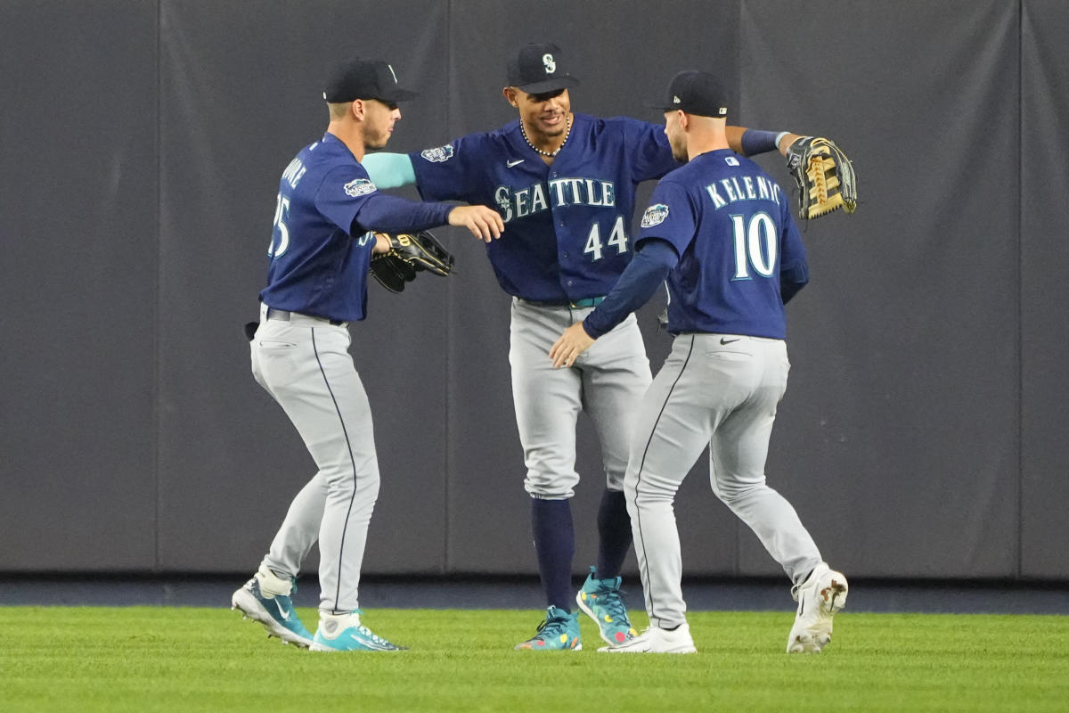 Seattle Mariners' Julio Rodriguez smiles as he answers questions