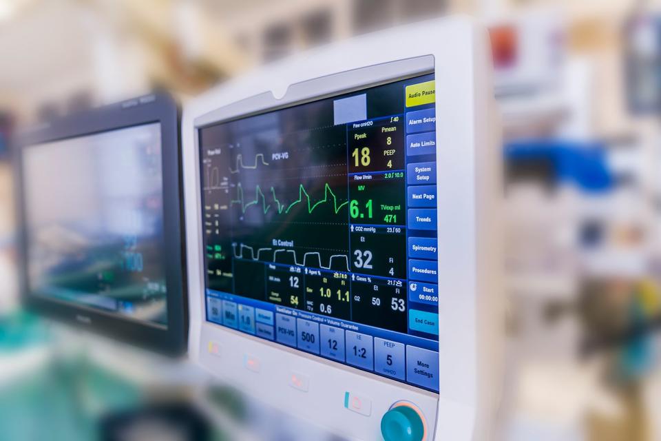 <p>Arctic-Images/Getty</p> Stock image of computer monitors in the operating theatre during heart valve replacement surgery EKG