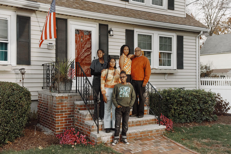 The Henry family outside their home in Malden on Nov. 18<span class="copyright">Tony Luong for TIME</span>