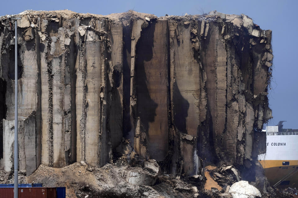 Silos in the north block of the Beirut Port, blackened by a dayslong fire, in Lebanon, Friday, July 22, 2022. The latest fire at the silos’ damaged north block was due to fermenting wheat and grains still trapped inside the building, outgoing Economy Minister Amin Salam told reporters. On Aug. 4, 2020, hundreds of tons of ammonium nitrate, a highly explosive material used in fertilizers that had been improperly stored for years in the giant silos exploded. (AP Photo/Hassan Ammar)