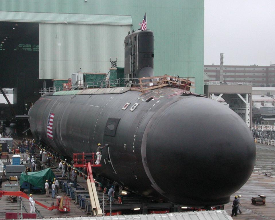 A Virginia-class submarine, SSN-774, leaves an assembly building at the General Dynamics Electric Boat shipyard in Groton, Conn., in this August 2003 file photo.