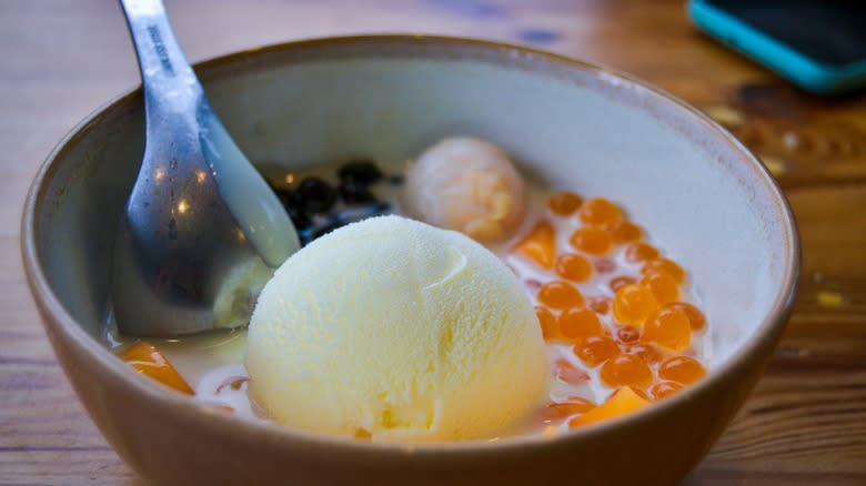 ice cream served with lychee jelly and other toppings