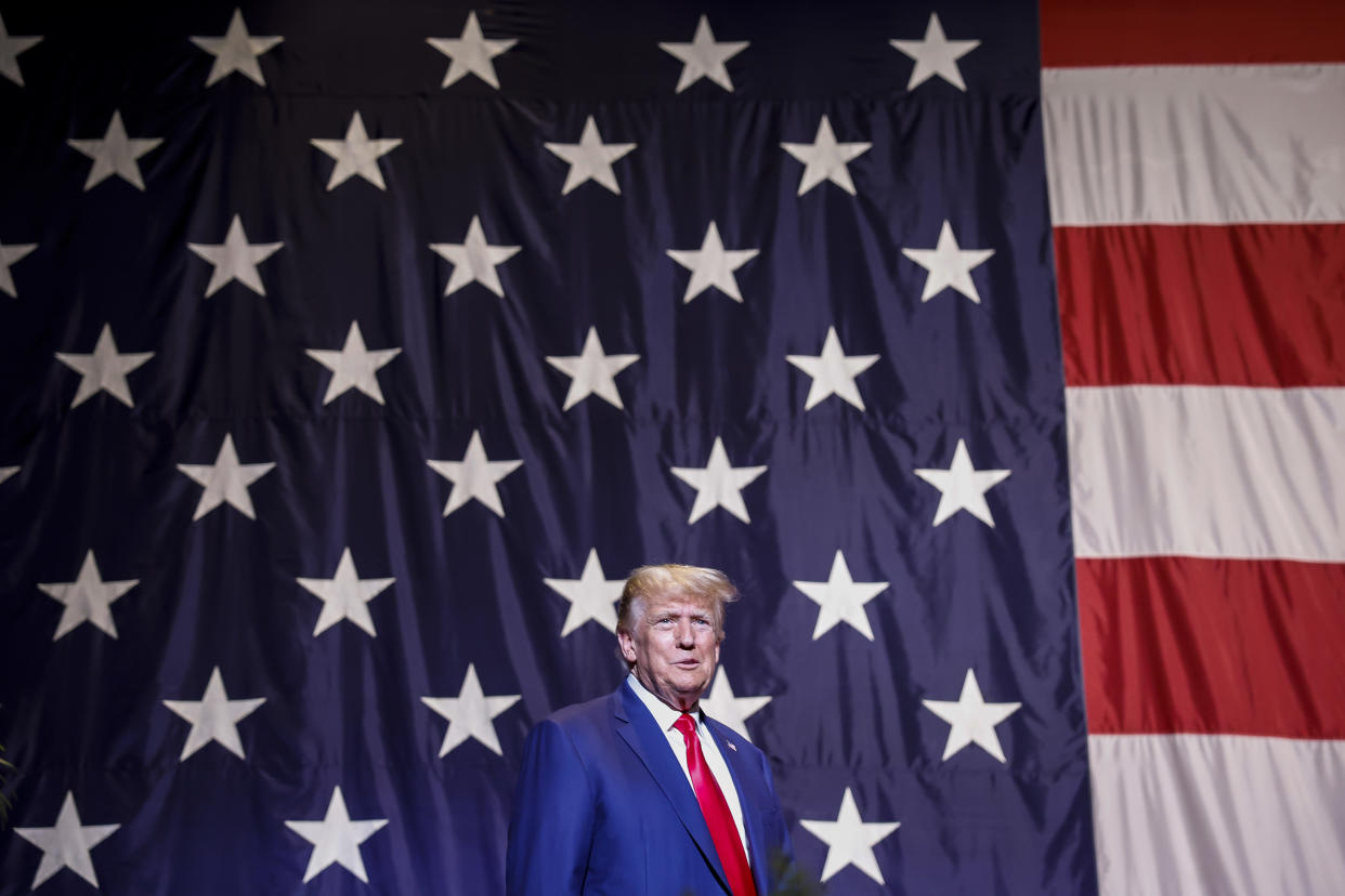 Former President Donald Trump in front of a huge U.S. flag at the Georgia state GOP convention.