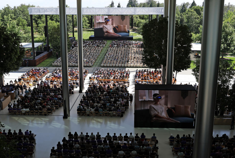 CUPERTINO, CALIFORNIA - JUNE 10: Attendees watch a video presentation during the Apple Worldwide Developers Conference (WWDC) on June 10, 2024 in Cupertino, California. Apple will announce plans to incorporate artificial intelligence (AI) into Apple software and hardware. (Photo by Justin Sullivan/Getty Images)