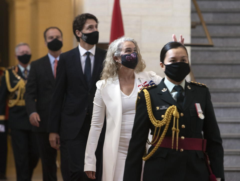 Prime Minister Justin Trudeau and Gov. Gen. Julie Payette make their way to the Senate for the throne speech, Wednesday, September 23, 2020 in Ottawa. (Fred Chartrand/The Canadian Press via AP)